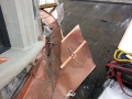 seaming the radius valley into the metal roof