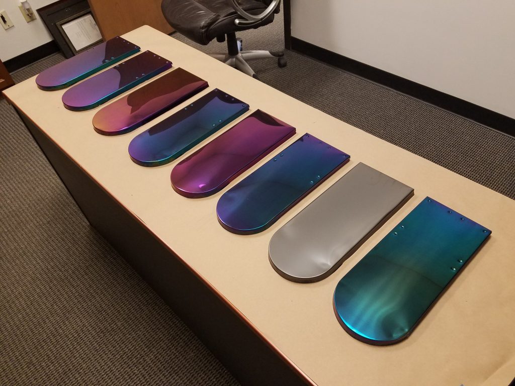 Beaver tail tile that is iridescent on a table