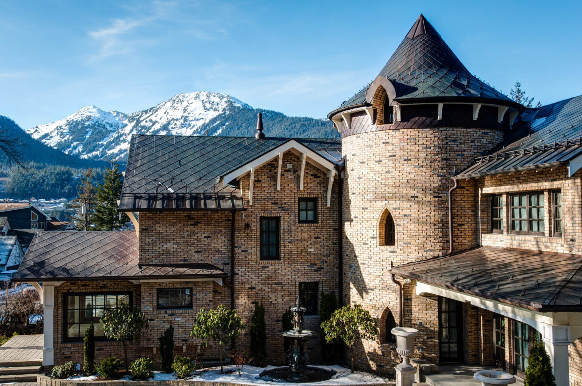 Metal shingles on large brick home