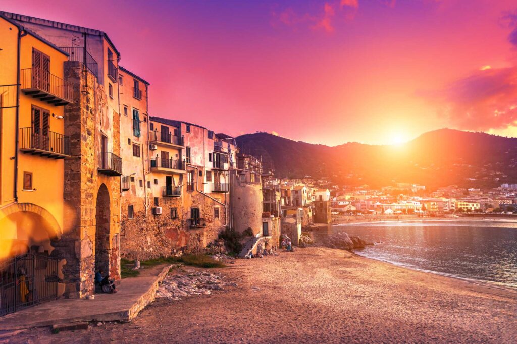 Colorful building on the beach at sunset