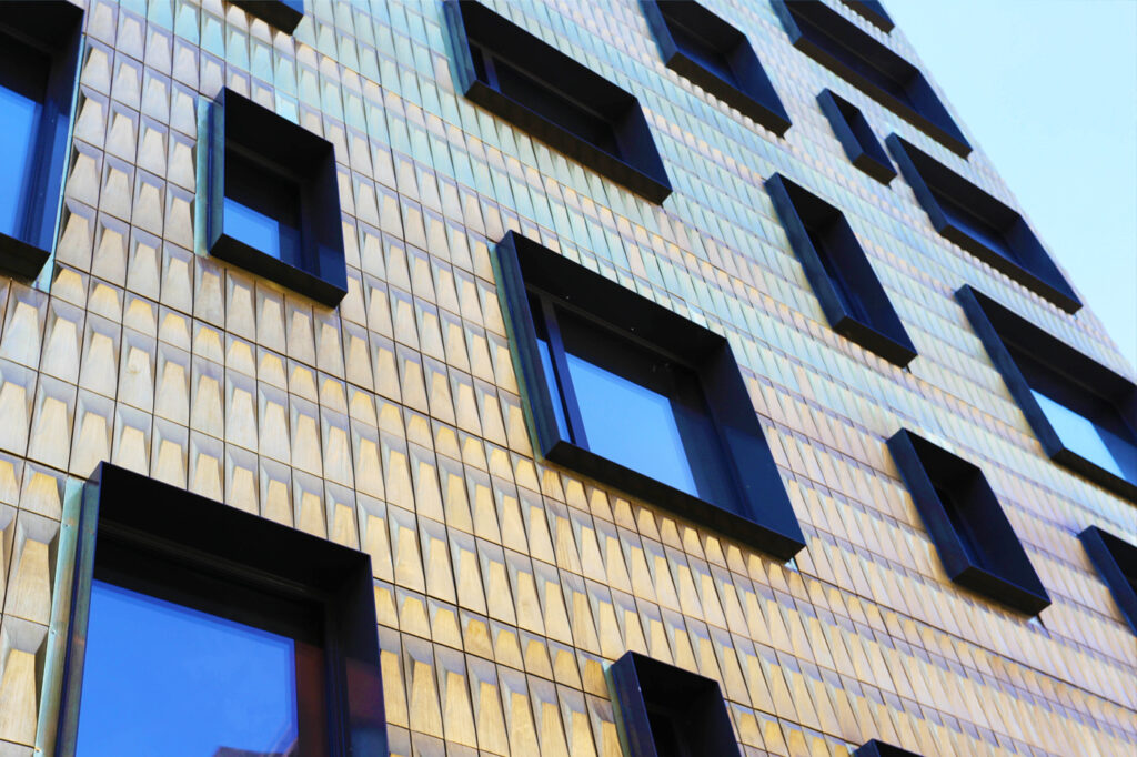 Side view of city building with custom Brass Rainscreen
