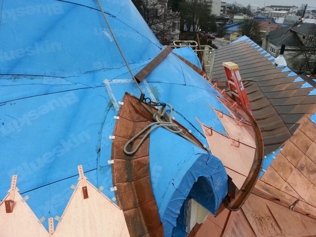 copper metal roof installation on a turret showing the indriect fasteners to help with expansion and contraction