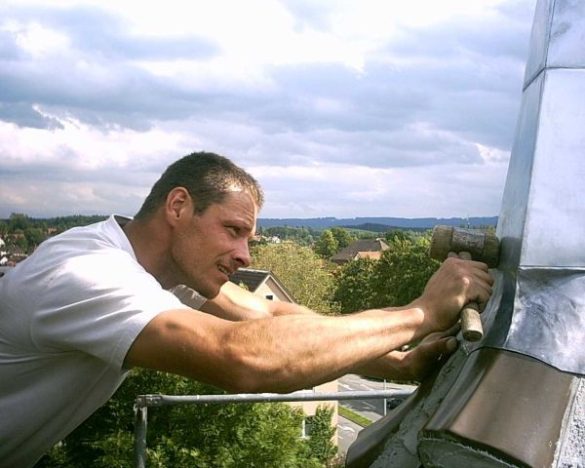 Master craftsmanship on a zinc finial and zinc roof