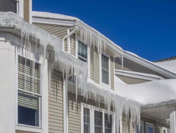 House with severe ice dams illustrating the impact of freeze-thaw cycles and poor insulation, highlighting common roofing challenges in Utah's high freeze-thaw environment.