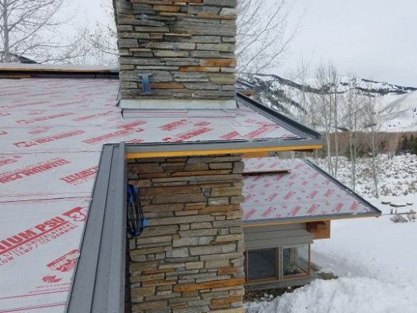 Progress photo of zinc roof installation in a heavy snow load area.